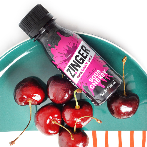 Sour Cherry Zinger shot on a plate with cherries