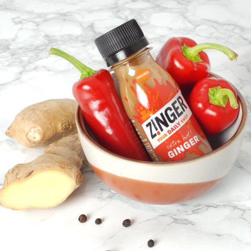 
                  
                    Organic Extra Hot Ginger Zinger Shot in a bowl with ingredients 
                  
                