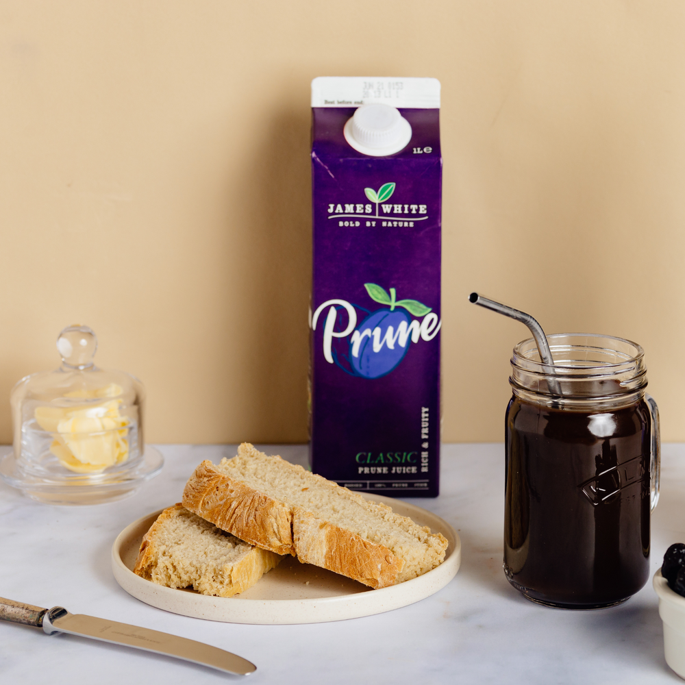 
                  
                    Prune juice on a breakfast table with toast
                  
                